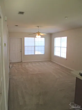 a view of an empty room with a window