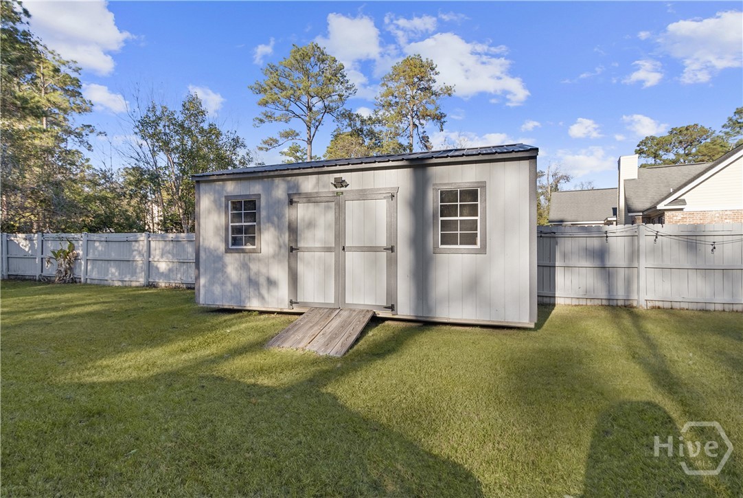 204 Haydon Court Rincon, GA 31326 - Photo 34 of 38 Backyard - Storage Shed - Grass Virtually Enhanced