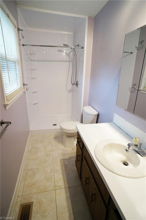 1721 Valley Brook Road Clemmons, NC 27012 - Photo 8 of 19 Master bath, new shower insert and duraceramic tile floors.