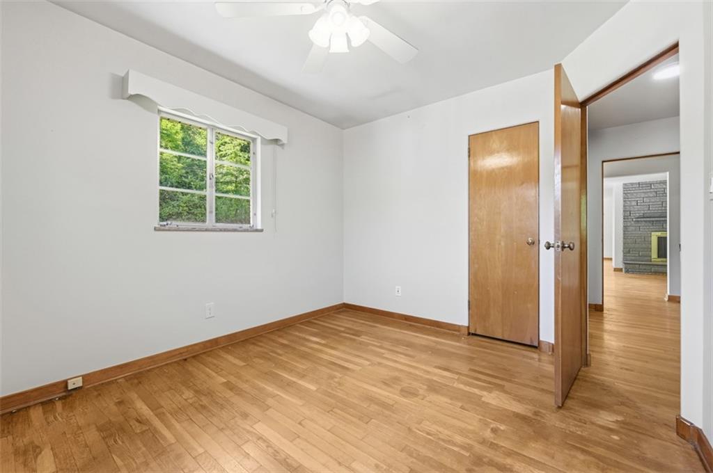 524 McElheny Road Glenshaw, PA 15116 - Photo 16 of 41 wooden floor in an empty room with a window