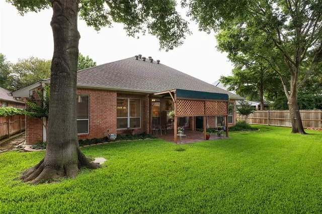 a view of a house with a yard porch and sitting area