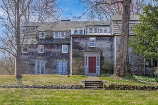 a brick building with a small yard in front of it