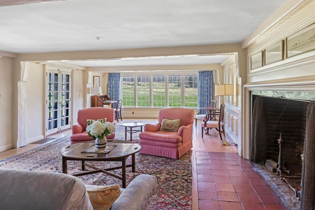 9 Maple Street Wenham, MA 01984 - Photo 17 of 42 a living room with furniture and a fireplace