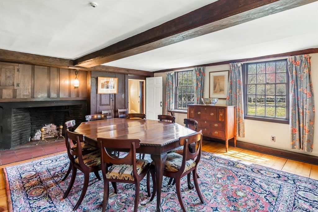 9 Maple Street Wenham, MA 01984 - Photo 23 of 42 a view of a dining room with furniture and chandelier