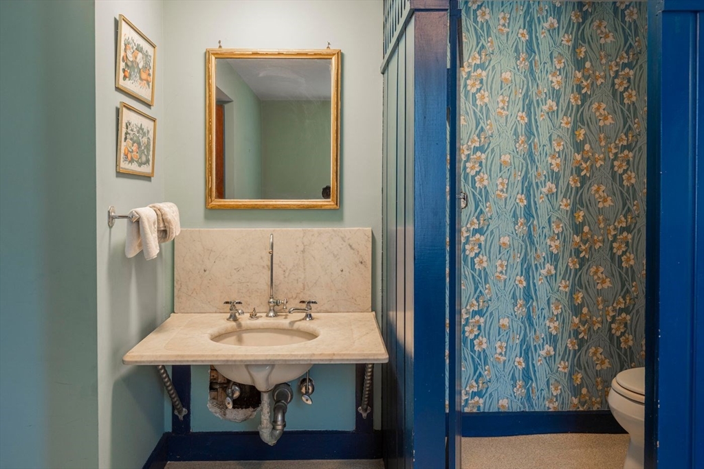 9 Maple Street Wenham, MA 01984 - Photo 27 of 42 a bathroom with a sink and a mirror
