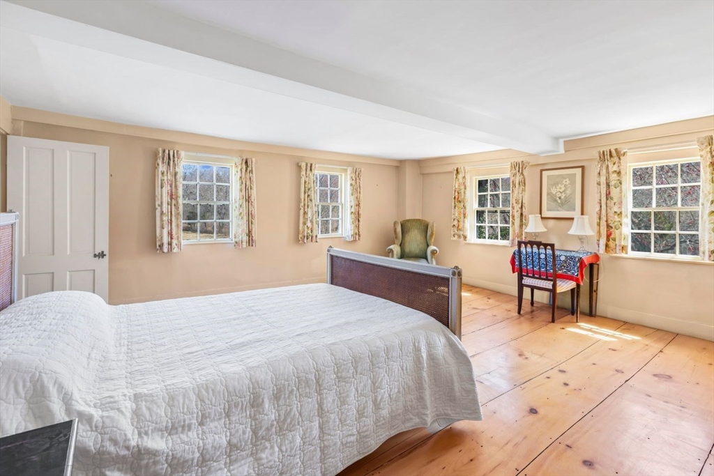 9 Maple Street Wenham, MA 01984 - Photo 31 of 42 a bedroom with a bed and a large window