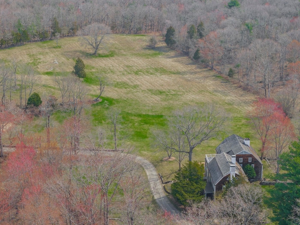 9 Maple Street Wenham, MA 01984 - Photo 5 of 42 a view of a yard with plants
