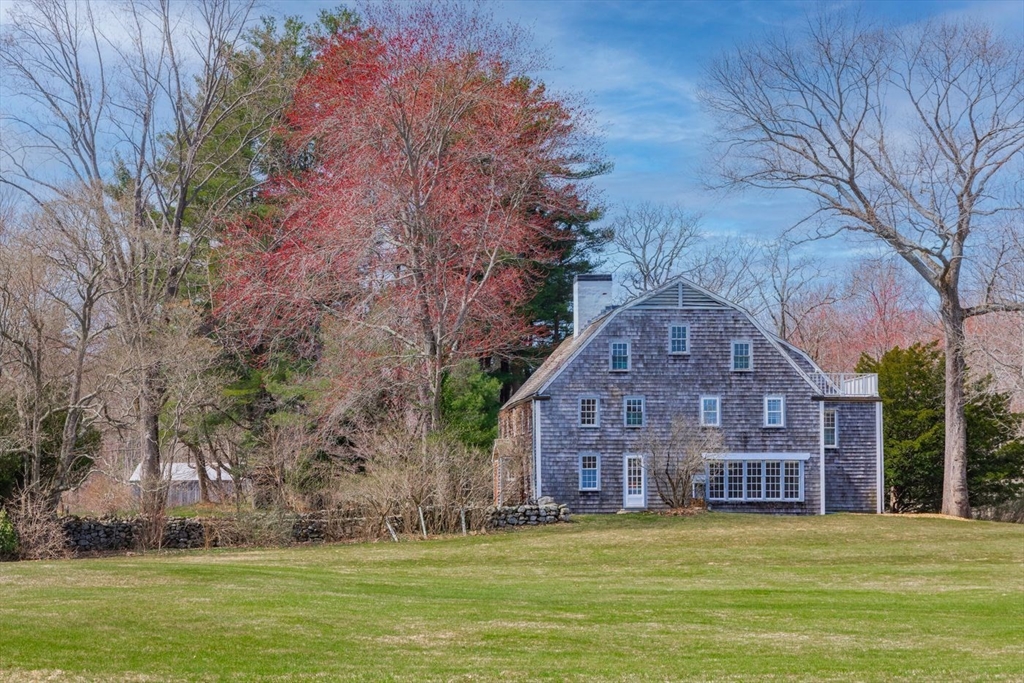 9 Maple Street Wenham, MA 01984 - Photo 6 of 42 a view of a big house with a big yard and large trees