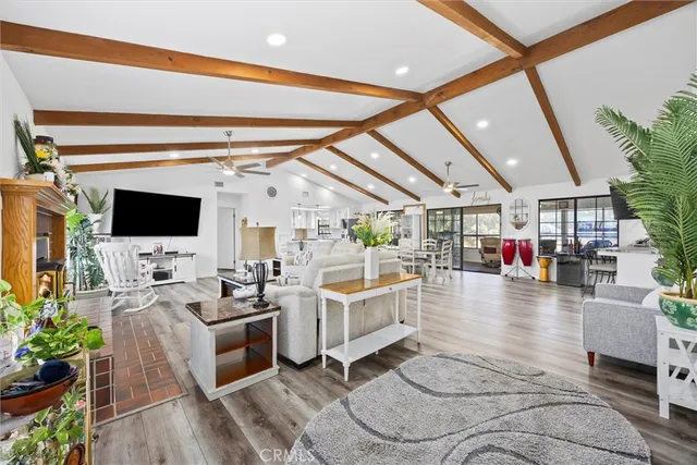 a living room with furniture and flat screen tv