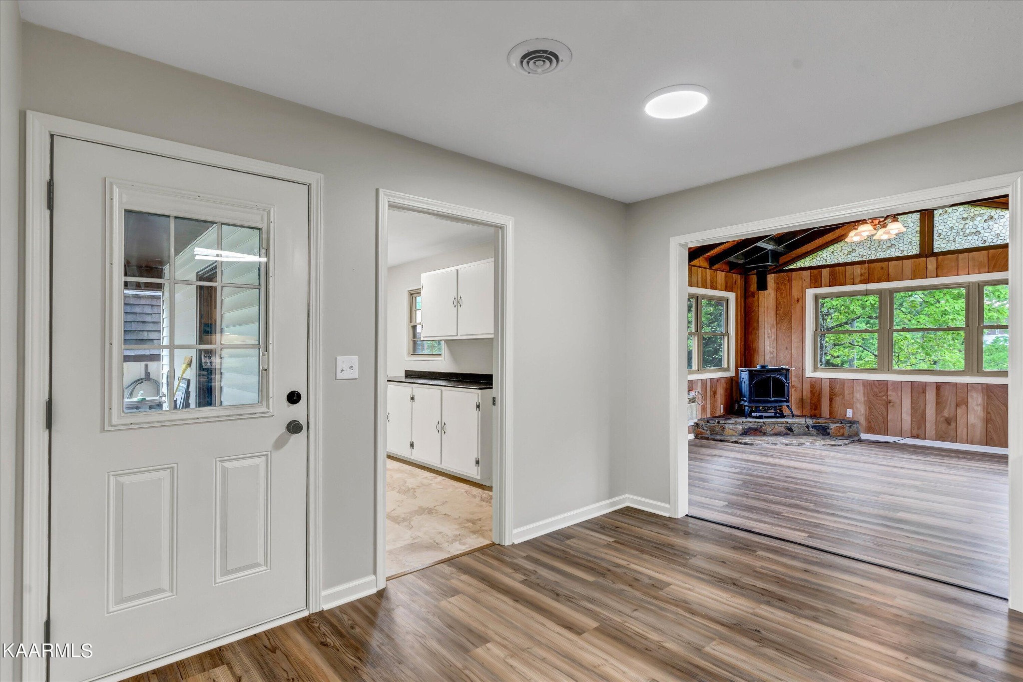 615 Kings Row Sevierville, TN 37863 - Photo 13 of 26 an empty room with wooden floor and windows