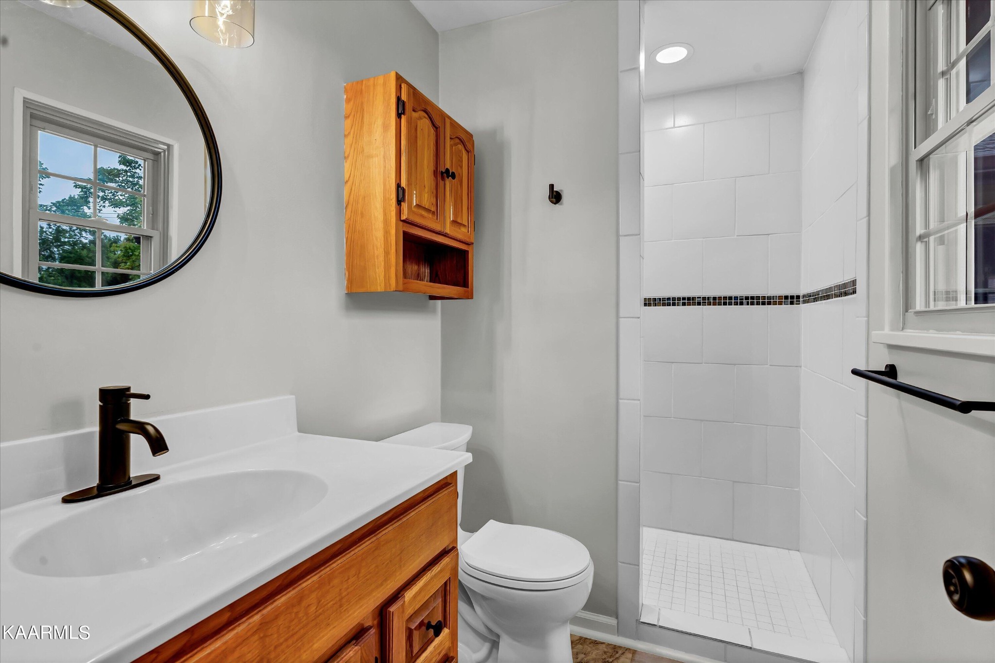 615 Kings Row Sevierville, TN 37863 - Photo 23 of 26 a bathroom with a sink and a mirror