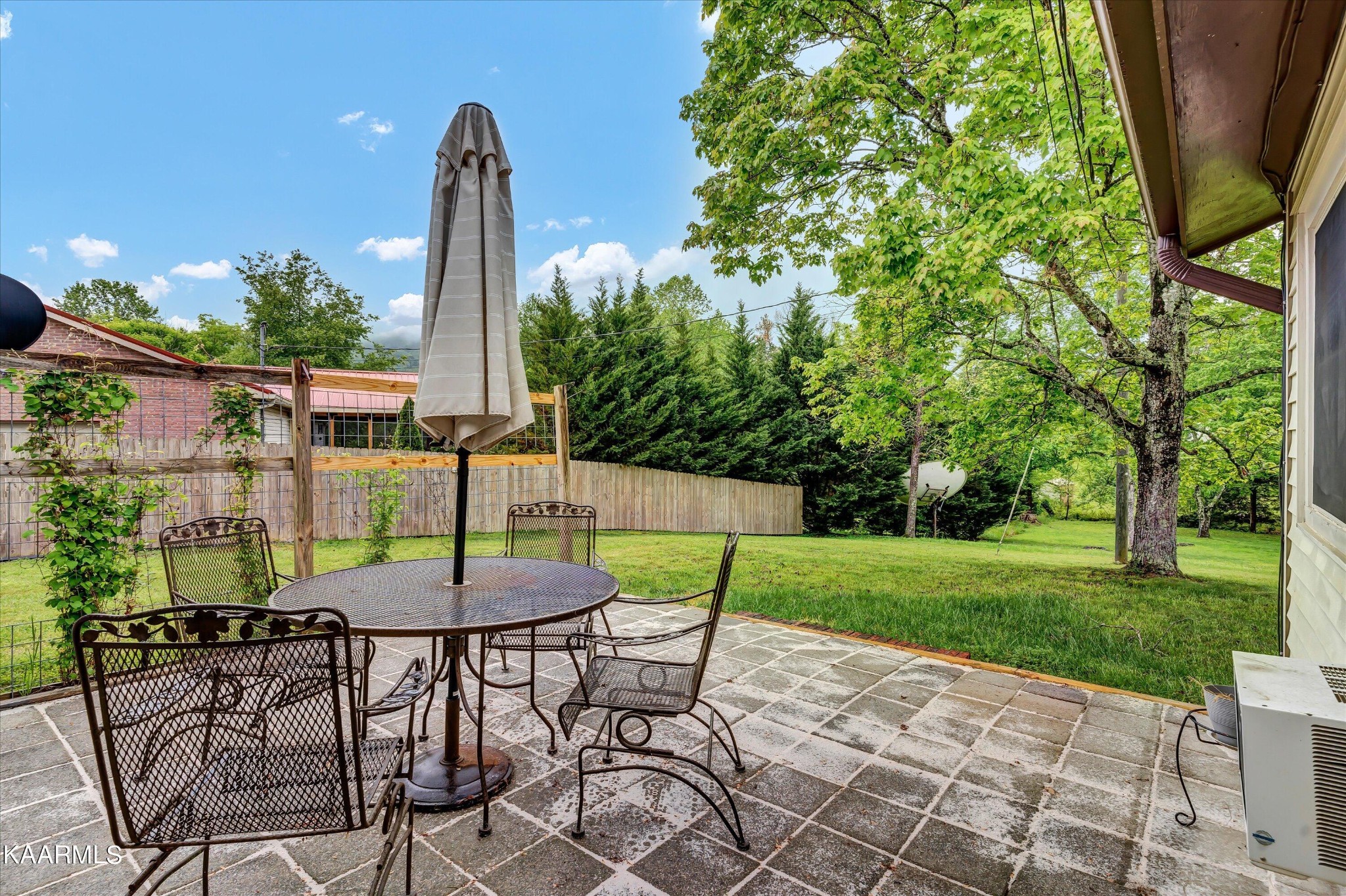 615 Kings Row Sevierville, TN 37863 - Photo 26 of 26 a view of a patio with a table and chairs and potted plants