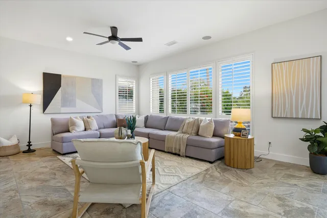 a view of a swimming pool and lounge chairs