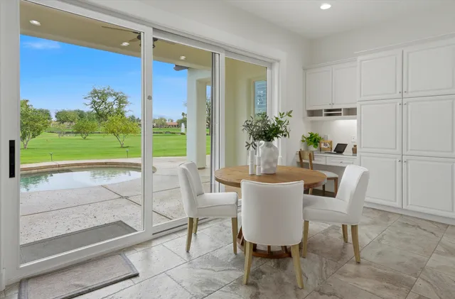 a spacious bedroom with a bed and a couch
