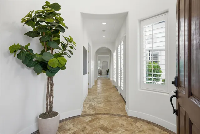a view of a lake with couches chairs