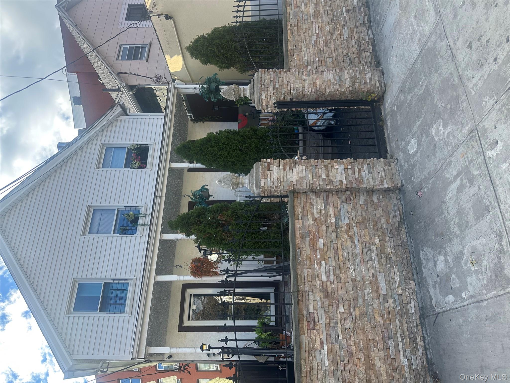 87 McLean Avenue Yonkers, NY 10705 - Photo 2 of 3 a view of a house with a yard