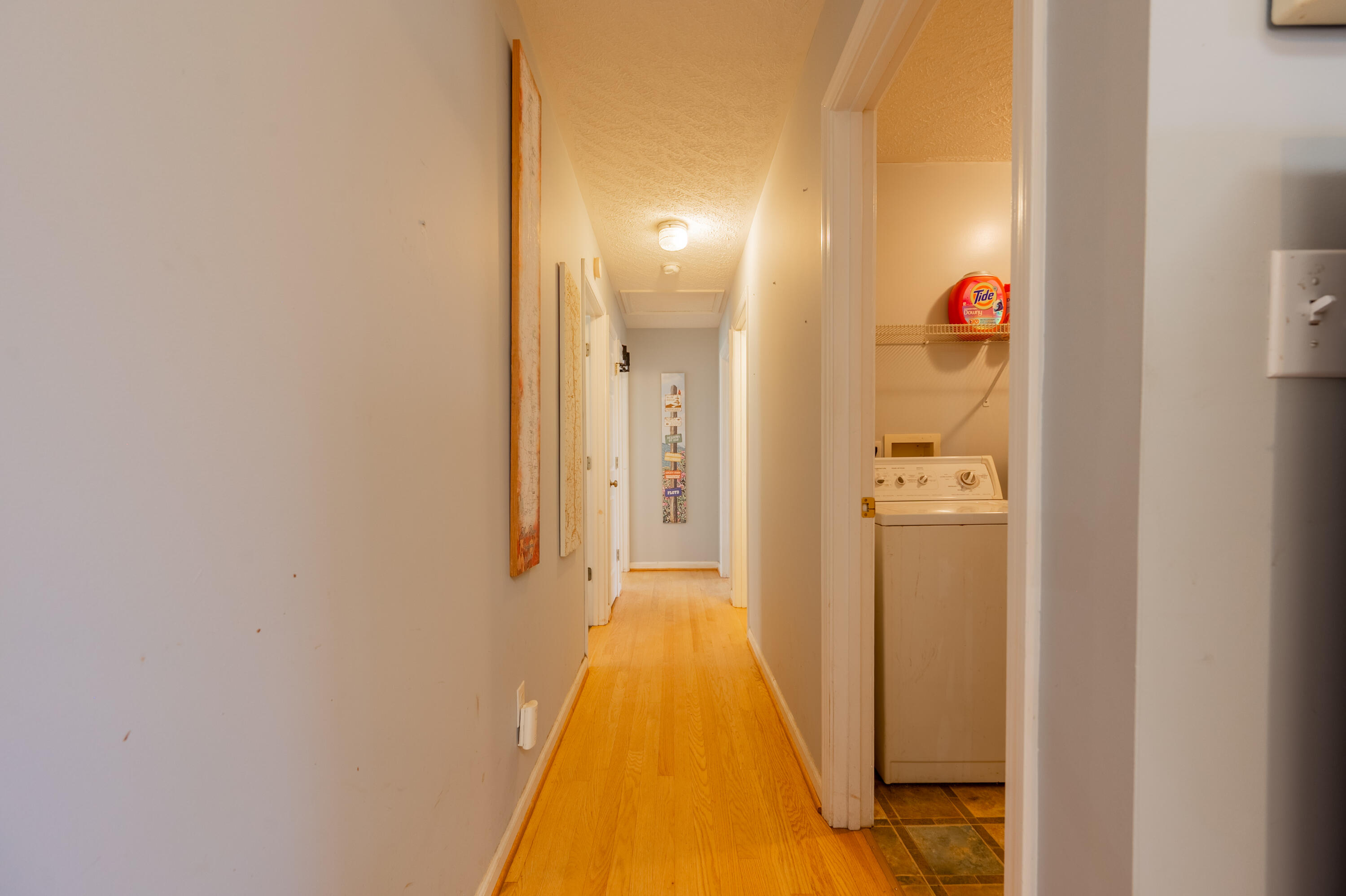 1126 Duncans Chapel Road Northwest Willis, VA 24380 - Photo 25 of 74 a view of a hallway with wooden floor