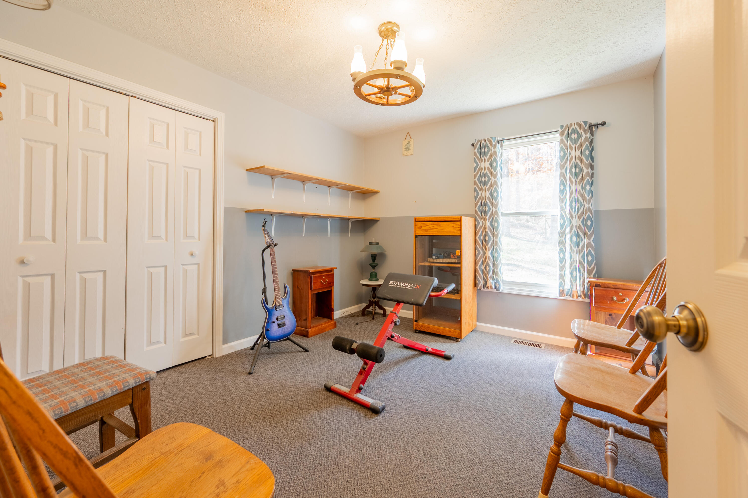 1126 Duncans Chapel Road Northwest Willis, VA 24380 - Photo 28 of 74 a view of a livingroom with workspace and a window