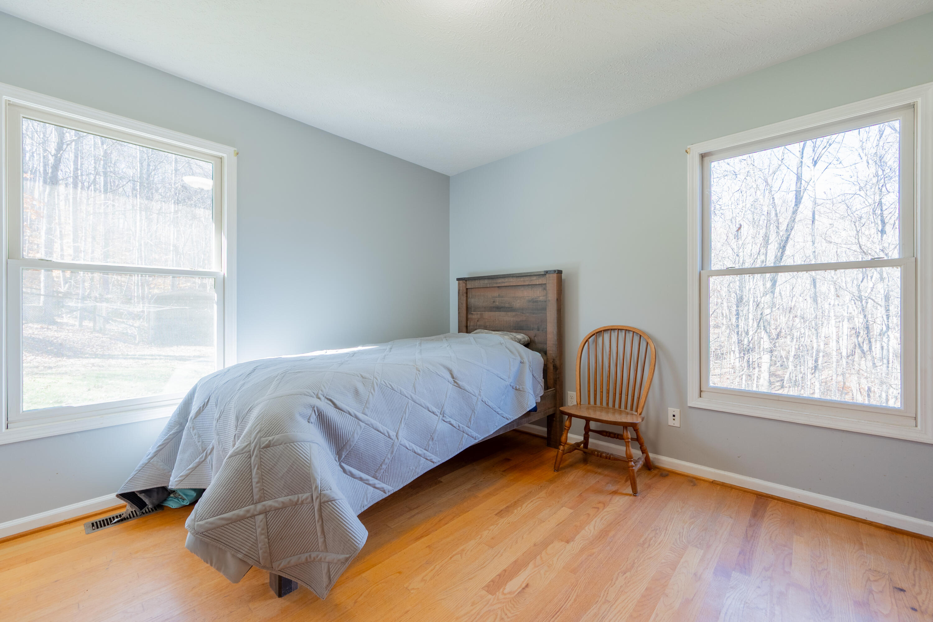 1126 Duncans Chapel Road Northwest Willis, VA 24380 - Photo 30 of 74 a bedroom with a bed chair and window