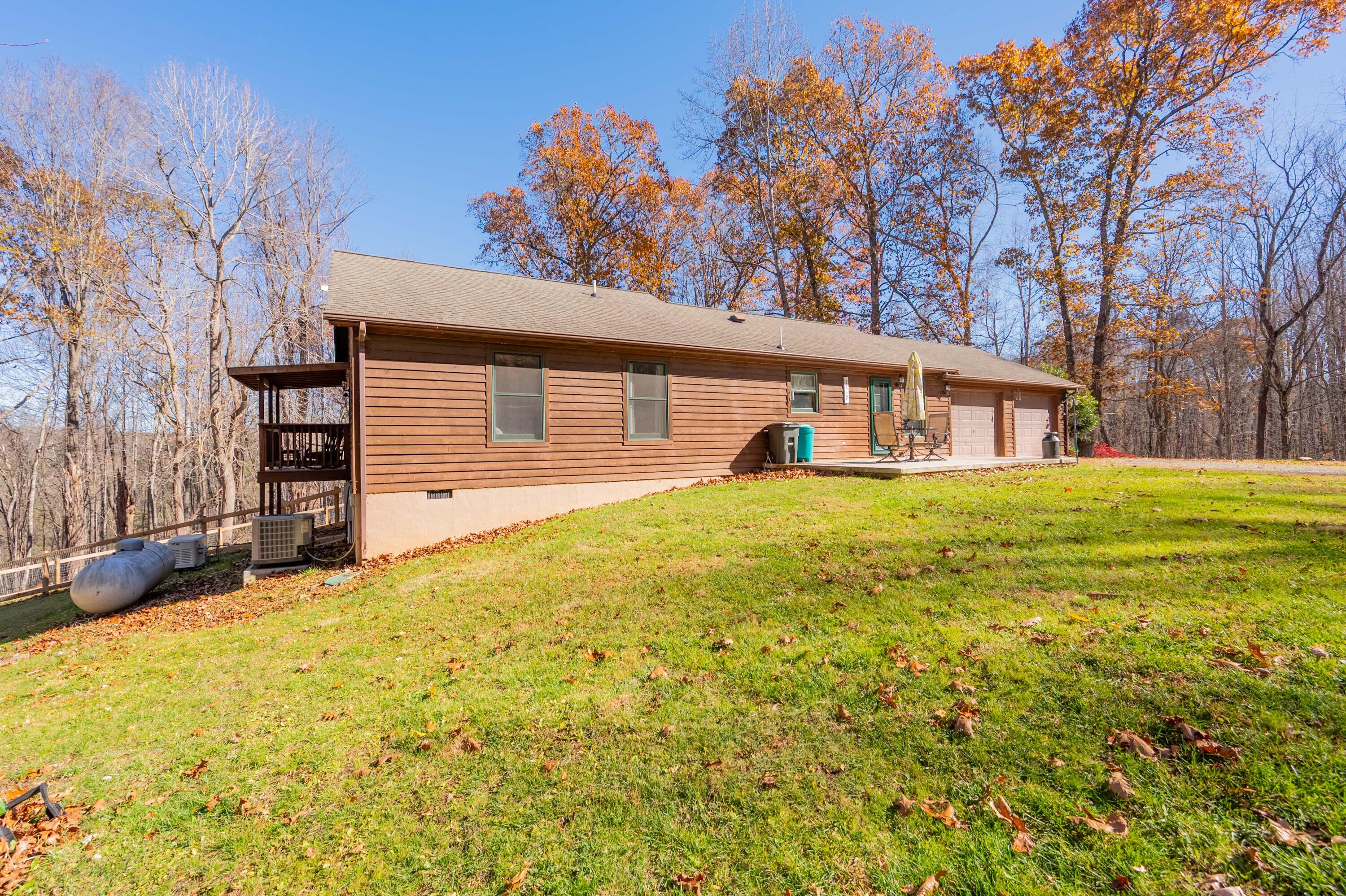1126 Duncans Chapel Road Northwest Willis, VA 24380 - Photo 45 of 74 a view of a house with a yard and garage