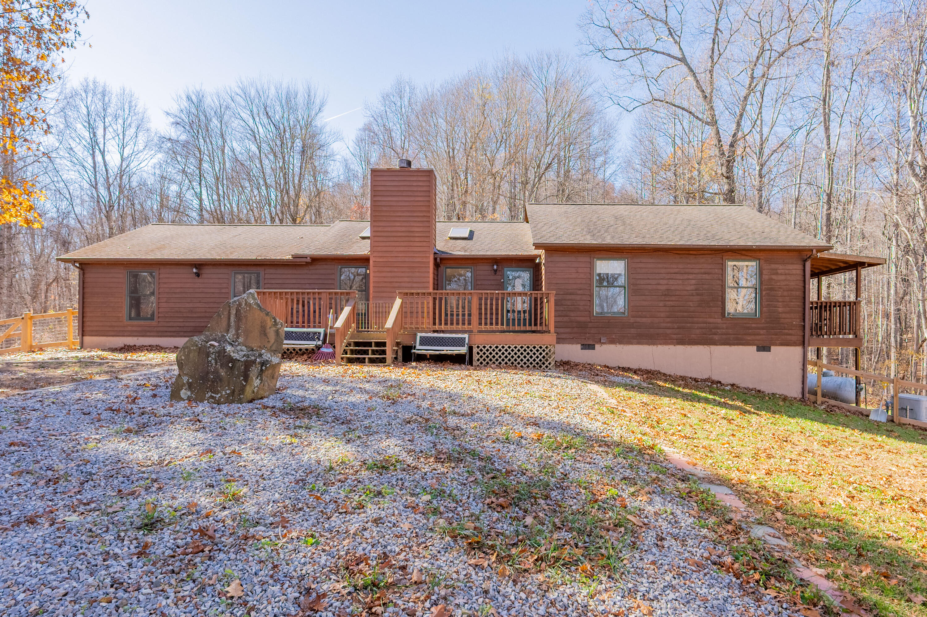 1126 Duncans Chapel Road Northwest Willis, VA 24380 - Photo 6 of 74 a view of a house with backyard stove and wooden fence