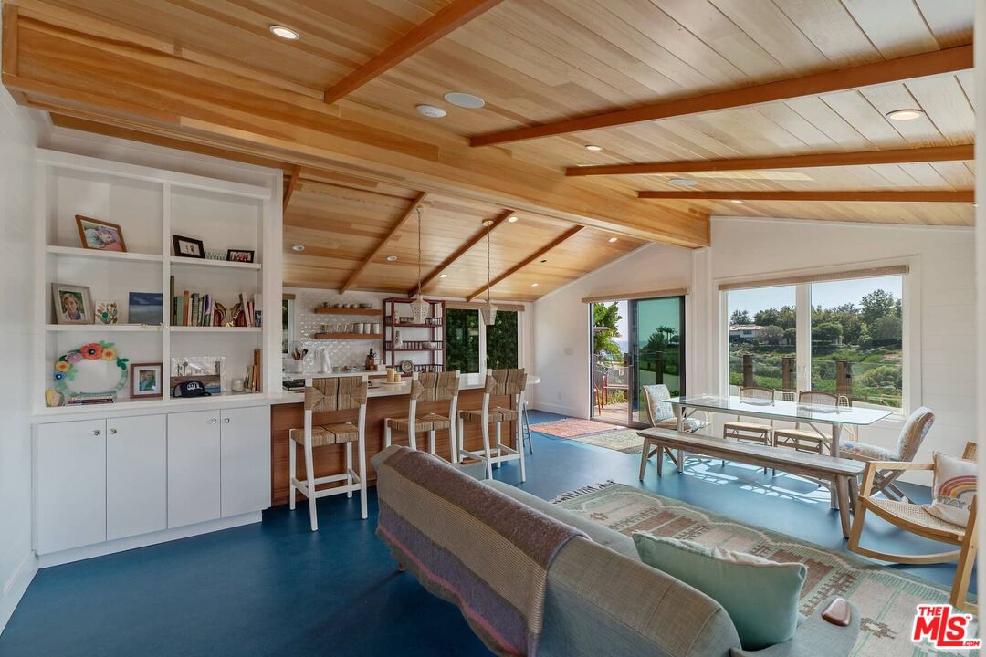 249 Paradise Cove Road Malibu, CA 90265 - Photo 10 of 41 a living room with lots of furniture and clutter