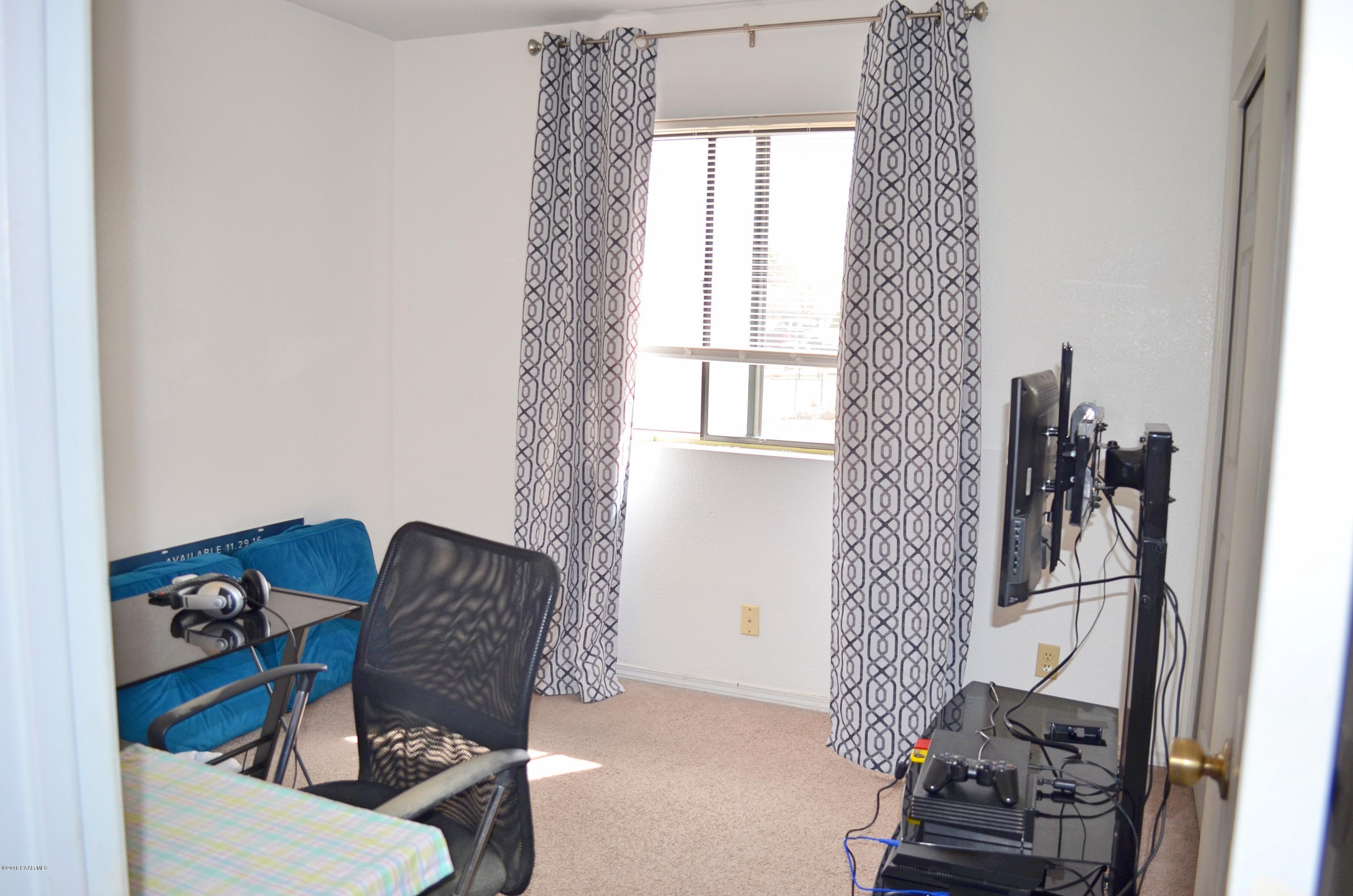 4660 North Miner Road Prescott Valley, AZ 86314 - Photo 13 of 20 a living room with furniture and a window