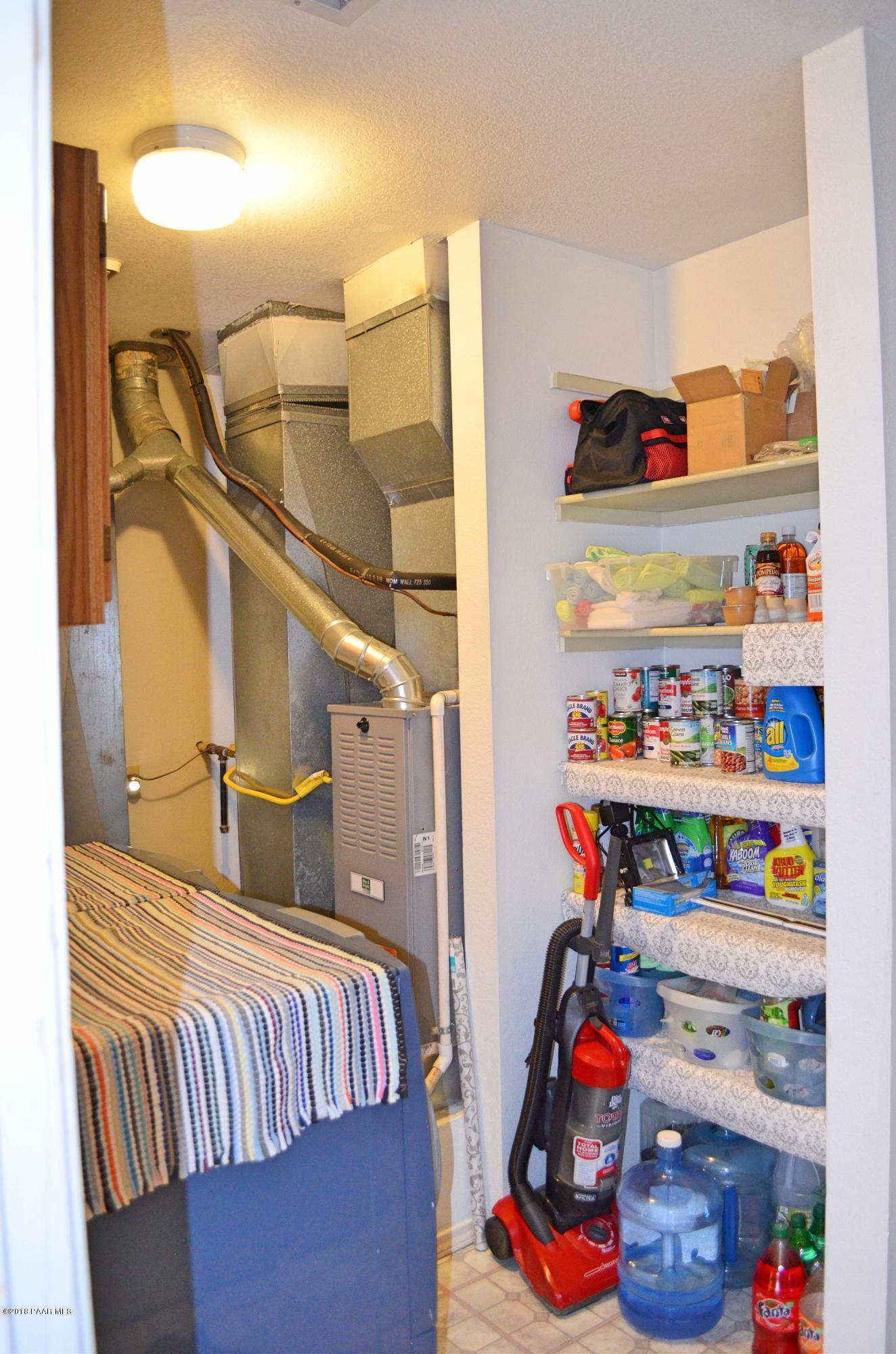 4660 North Miner Road Prescott Valley, AZ 86314 - Photo 17 of 20 a bed room with a bed and a window