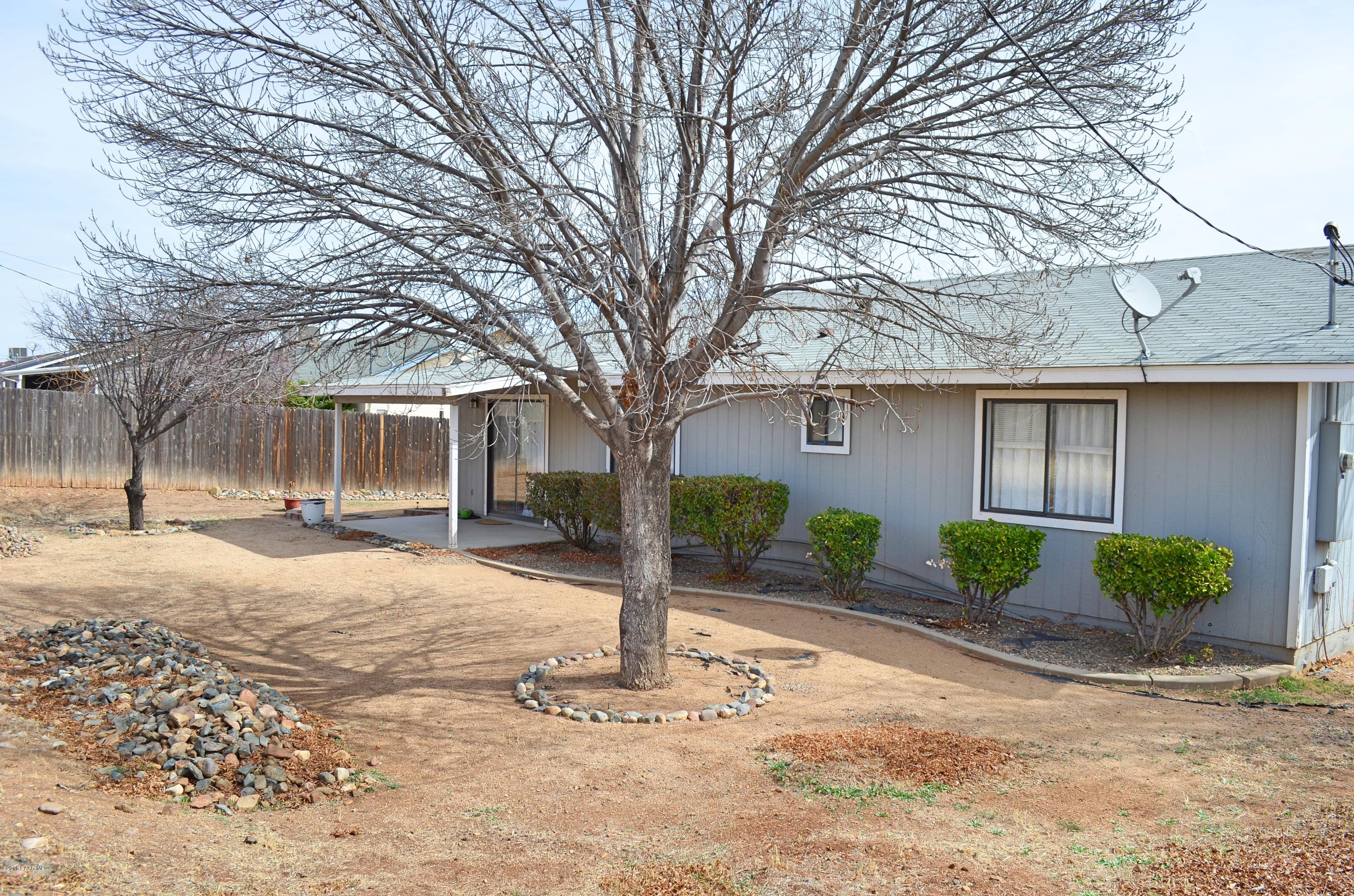 4660 North Miner Road Prescott Valley, AZ 86314 - Photo 20 of 20 a front view of a house with garden and trees