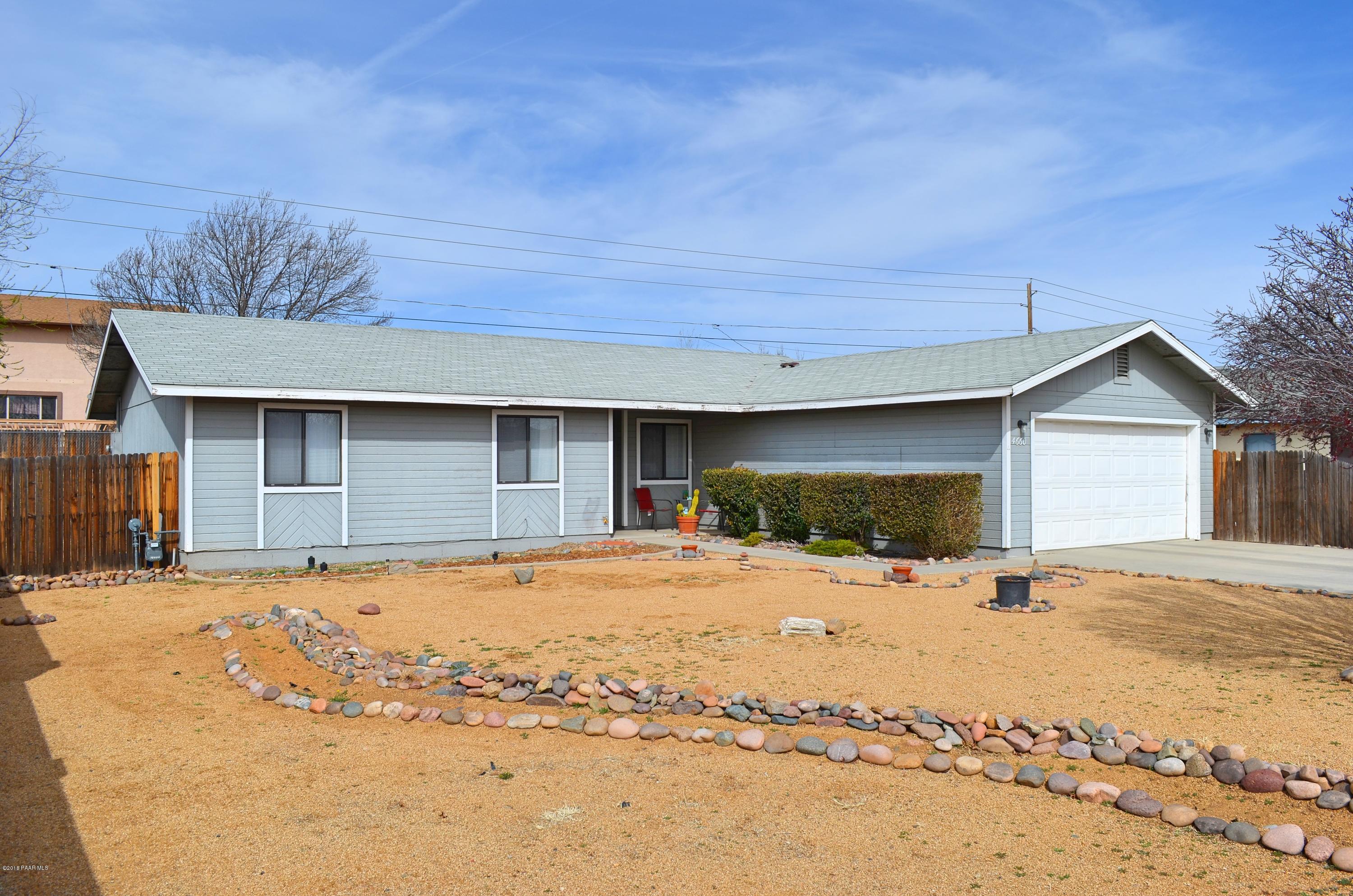 4660 North Miner Road Prescott Valley, AZ 86314 - Photo 2 of 20 a front view of a house with a yard