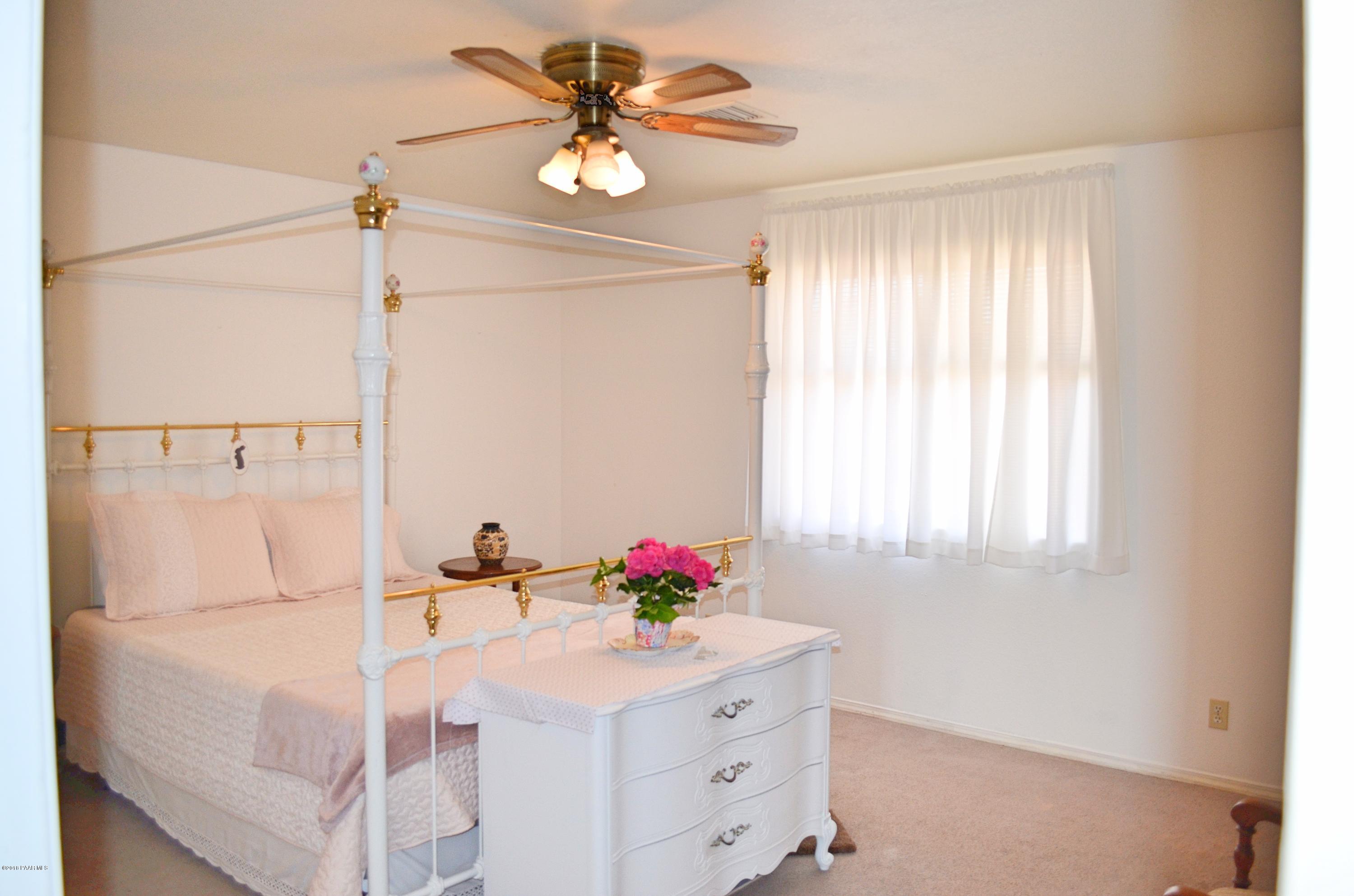 4660 North Miner Road Prescott Valley, AZ 86314 - Photo 10 of 20 a bathroom with a sink mirror and a window