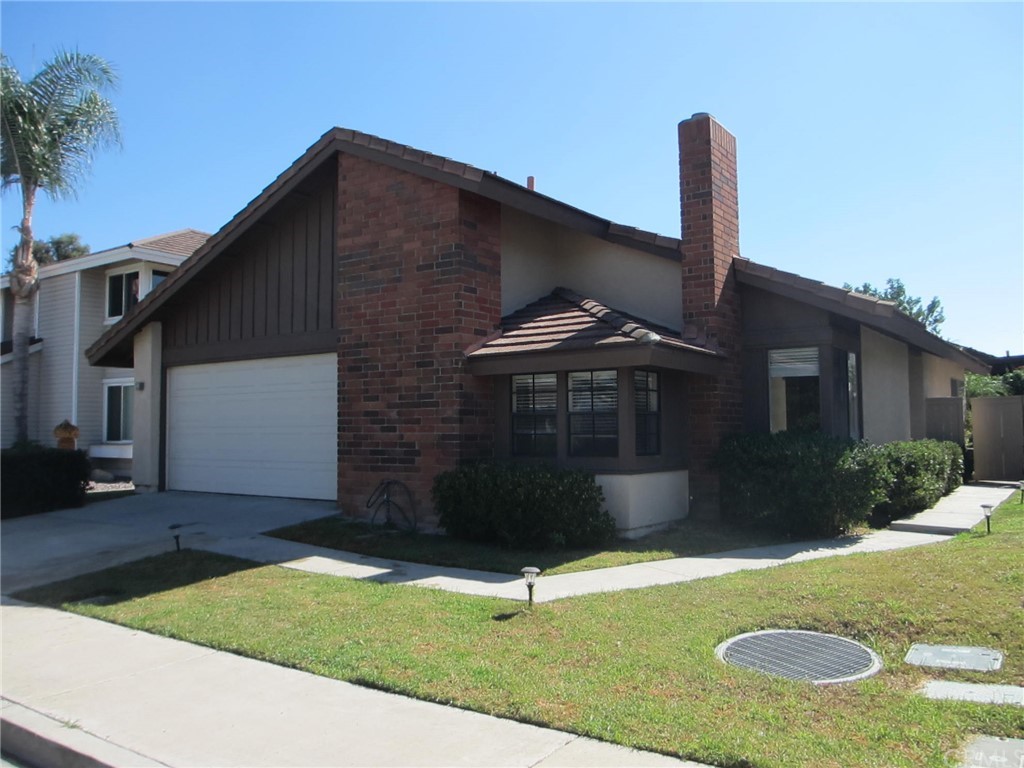12 Brookdale Irvine, CA 92604 - Photo 1 of 28 a front view of a house with garden