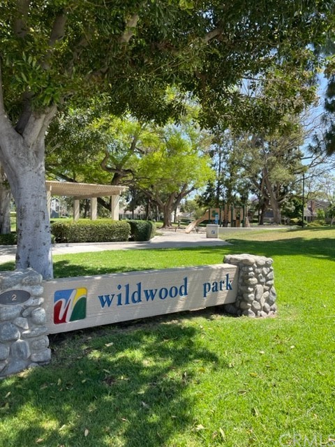 12 Brookdale Irvine, CA 92604 - Photo 24 of 28 a sign that is sitting in the grass of a building