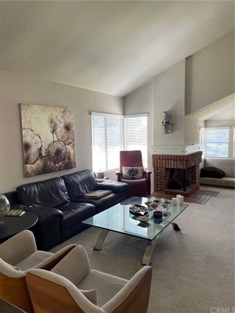 12 Brookdale Irvine, CA 92604 - Photo 7 of 28 a living room with furniture a rug and a window