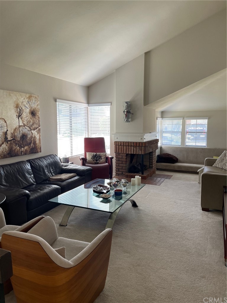 12 Brookdale Irvine, CA 92604 - Photo 9 of 28 a living room with furniture and a flat screen tv
