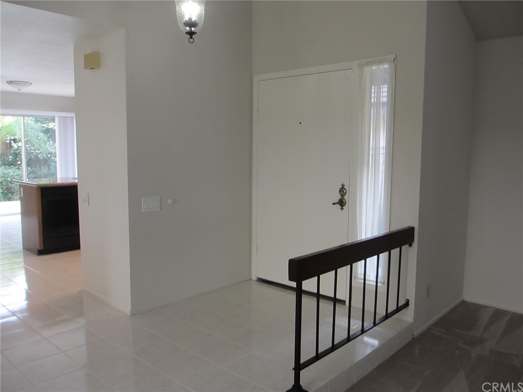 12 Brookdale Irvine, CA 92604 - Photo 10 of 28 a view of a hallway with wooden floor and stairs