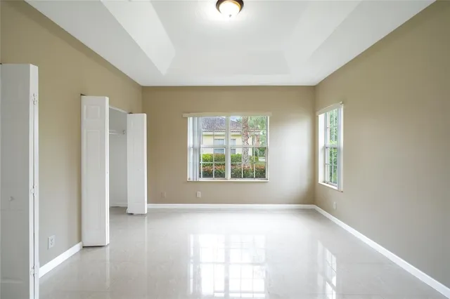 a view of an empty room with a window
