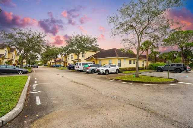 a view of a park with houses