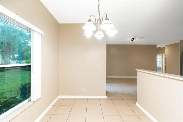 a view of a livingroom with a chandelier fan