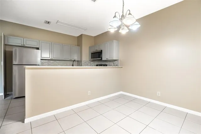 a view of a kitchen with a sink and dishwasher