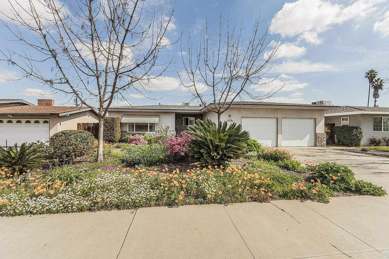 1416 South Church Avenue Reedley, CA 93654 - Photo 1 of 41 front view of a house with a bench