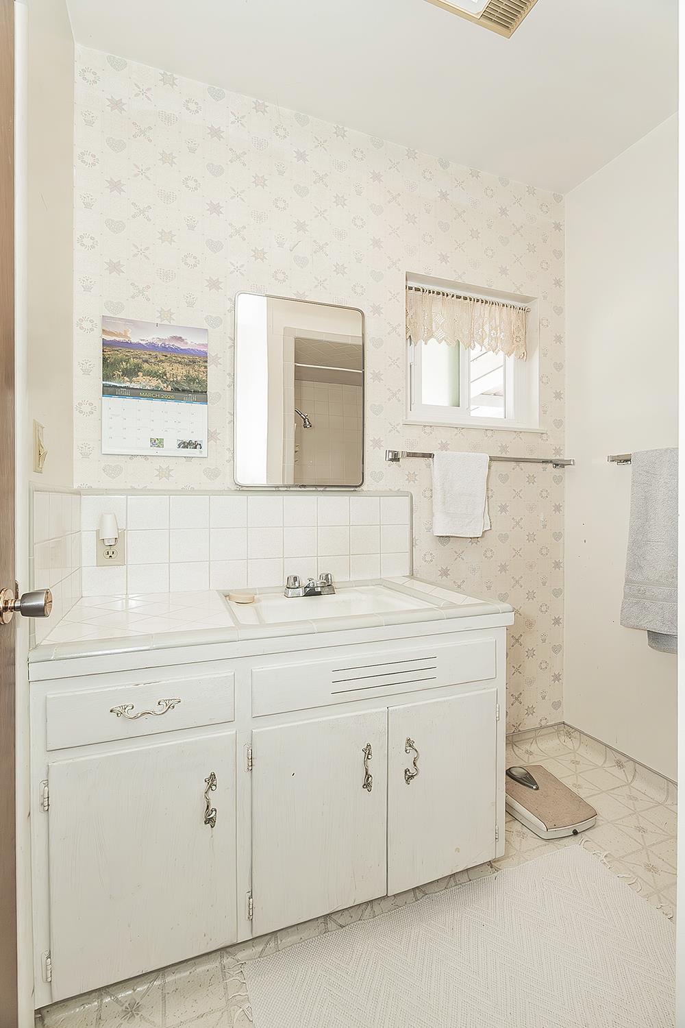 1416 South Church Avenue Reedley, CA 93654 - Photo 20 of 41 a bathroom with a sink and a mirror