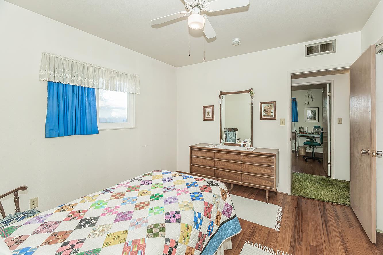 1416 South Church Avenue Reedley, CA 93654 - Photo 25 of 41 a bedroom with a bed and a dresser