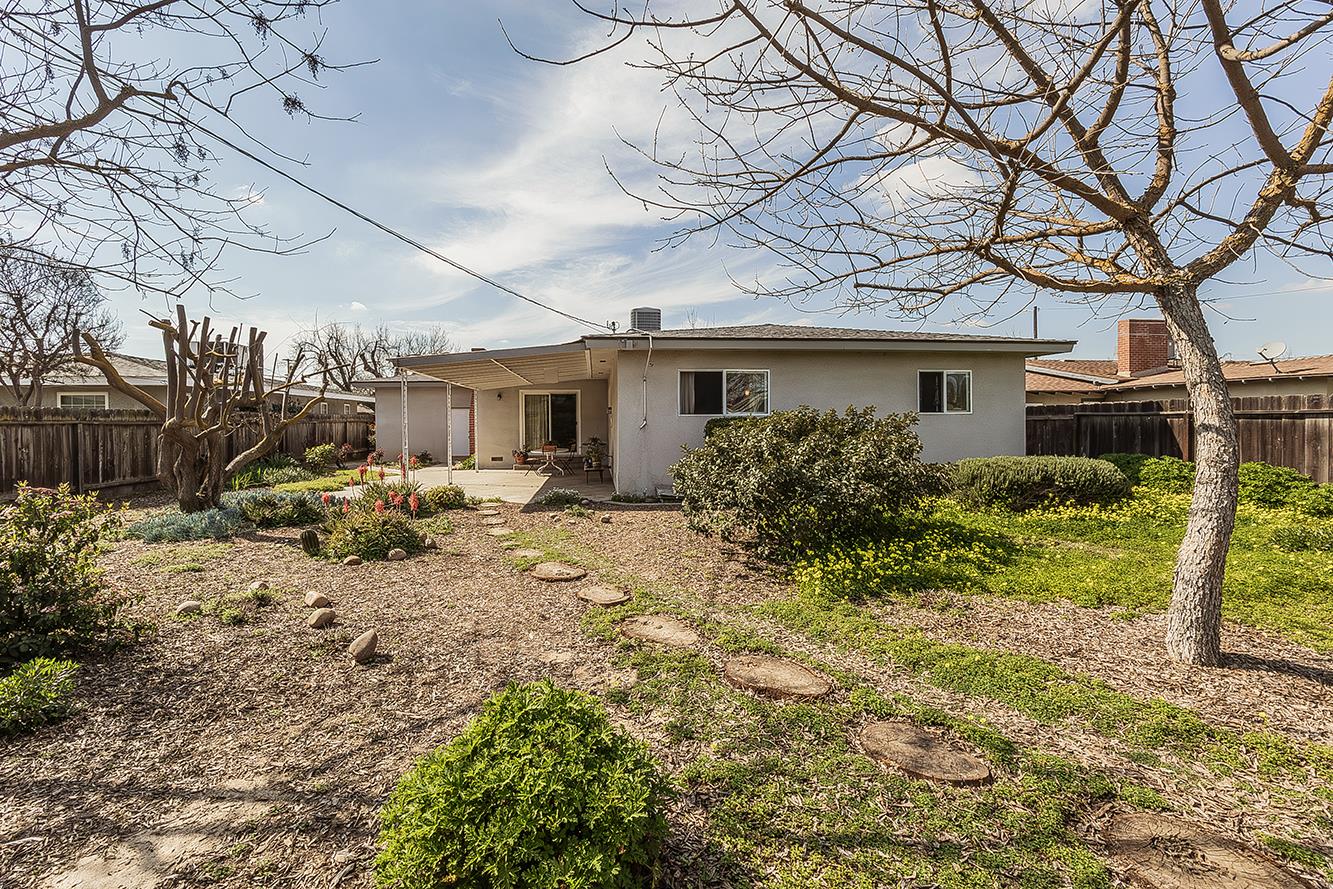 1416 South Church Avenue Reedley, CA 93654 - Photo 38 of 41 a front view of a house with a yard and garage