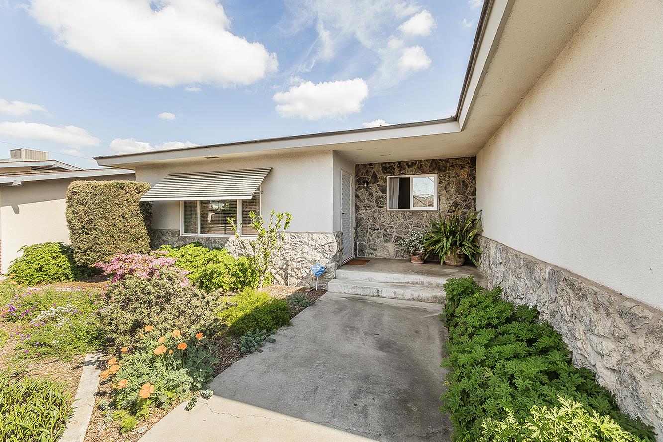 1416 South Church Avenue Reedley, CA 93654 - Photo 4 of 41 a front view of a house with garden