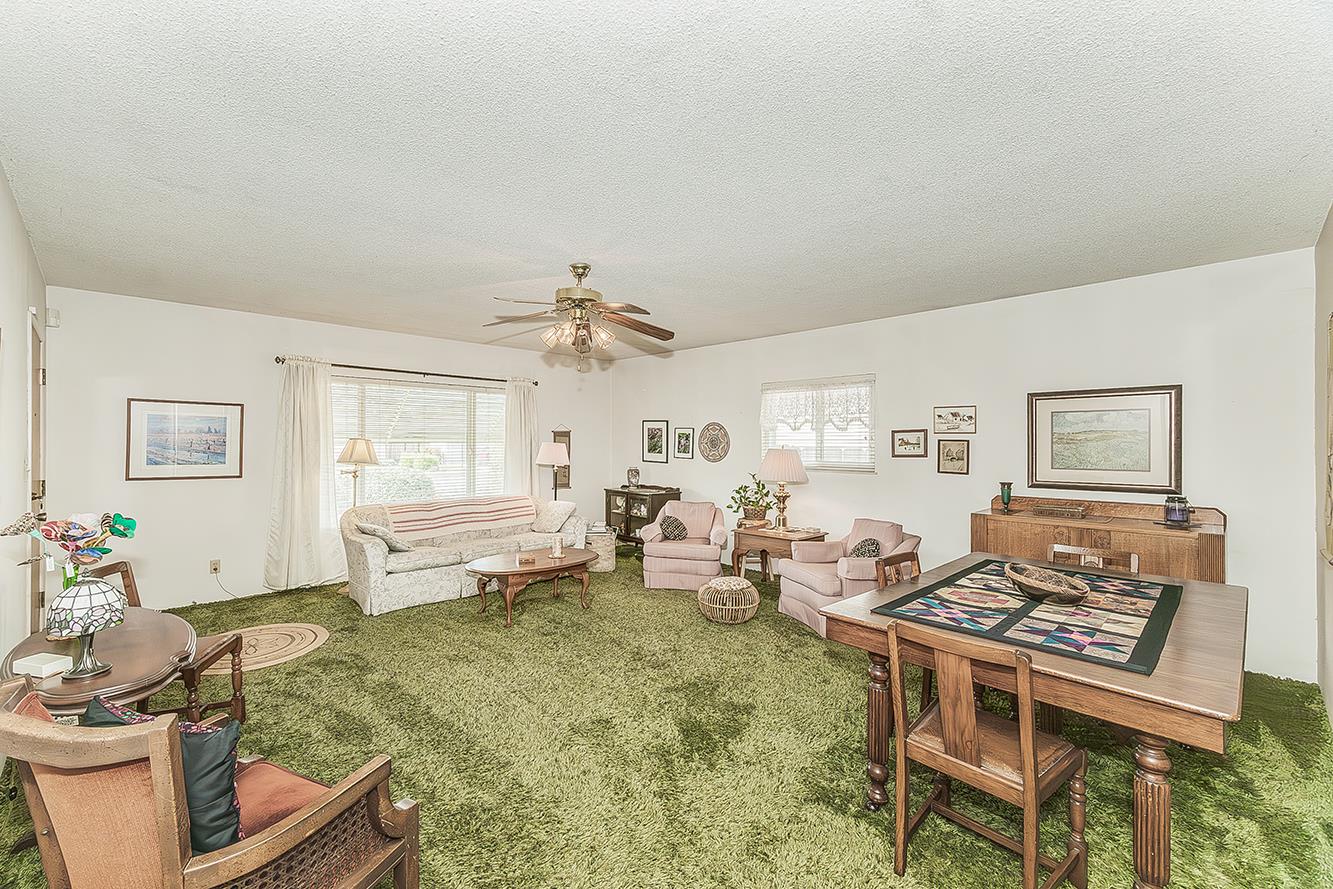 1416 South Church Avenue Reedley, CA 93654 - Photo 7 of 41 a living room with furniture and a table