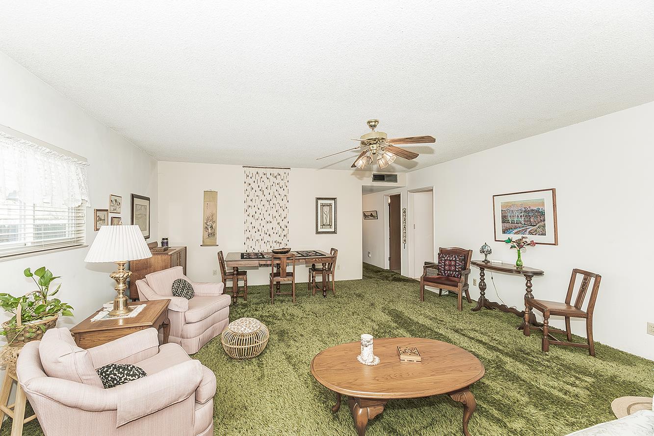 1416 South Church Avenue Reedley, CA 93654 - Photo 9 of 41 a living room with furniture and a dining table