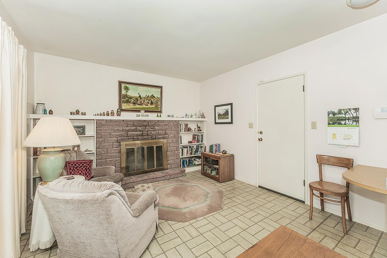 1416 South Church Avenue Reedley, CA 93654 - Photo 10 of 41 a living room with furniture and a fireplace