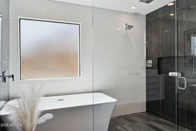 a bathroom with a glass shower door