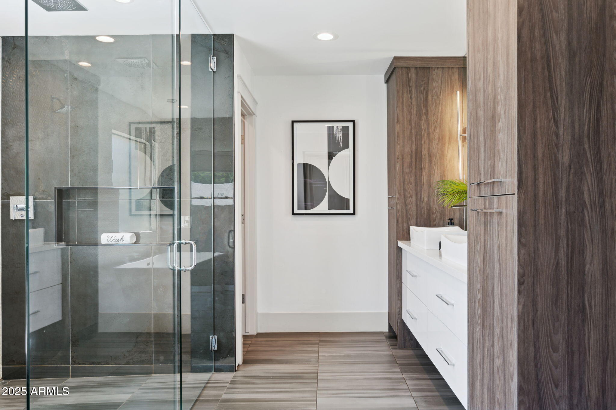 5301 East Tierra Buena Lane Scottsdale, AZ 85254 - Photo 23 of 61 a bathroom with a glass shower door